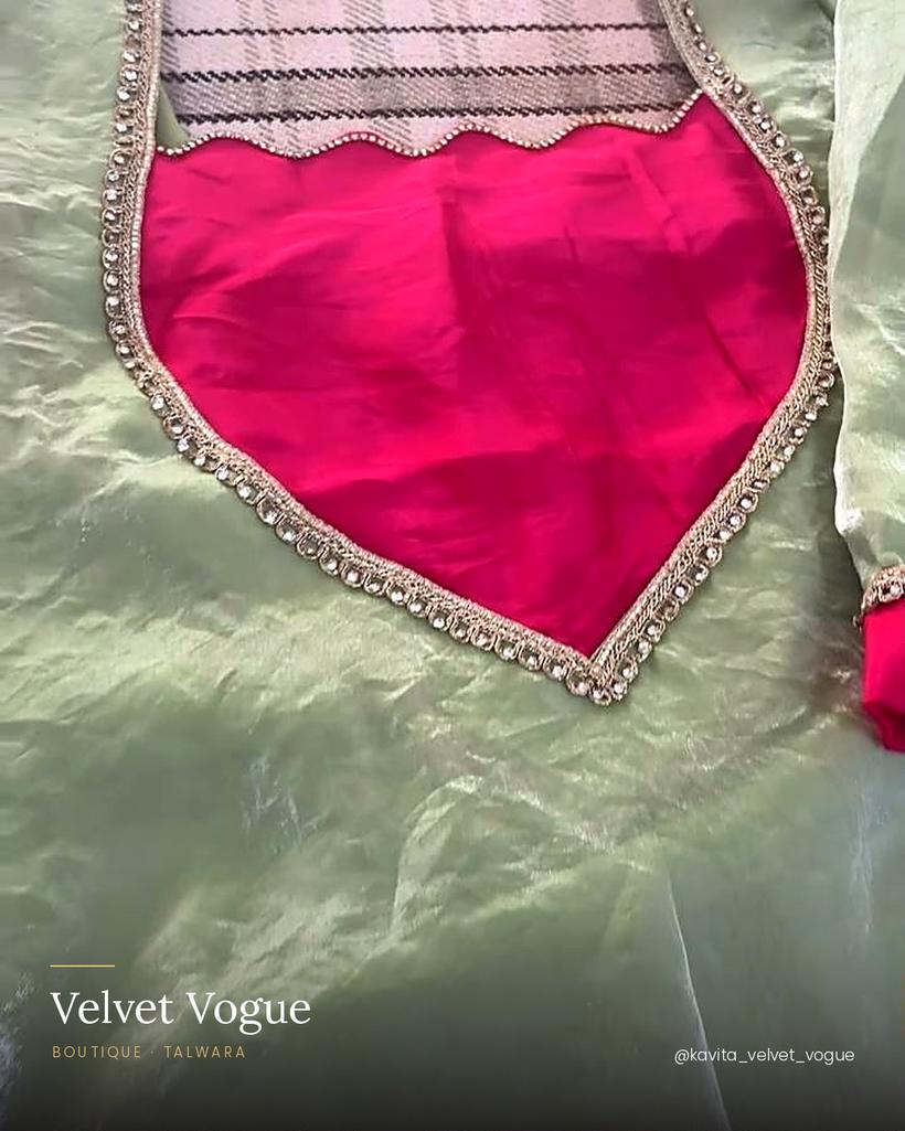 Mint over magenta — a scalloped neck edged with stones.