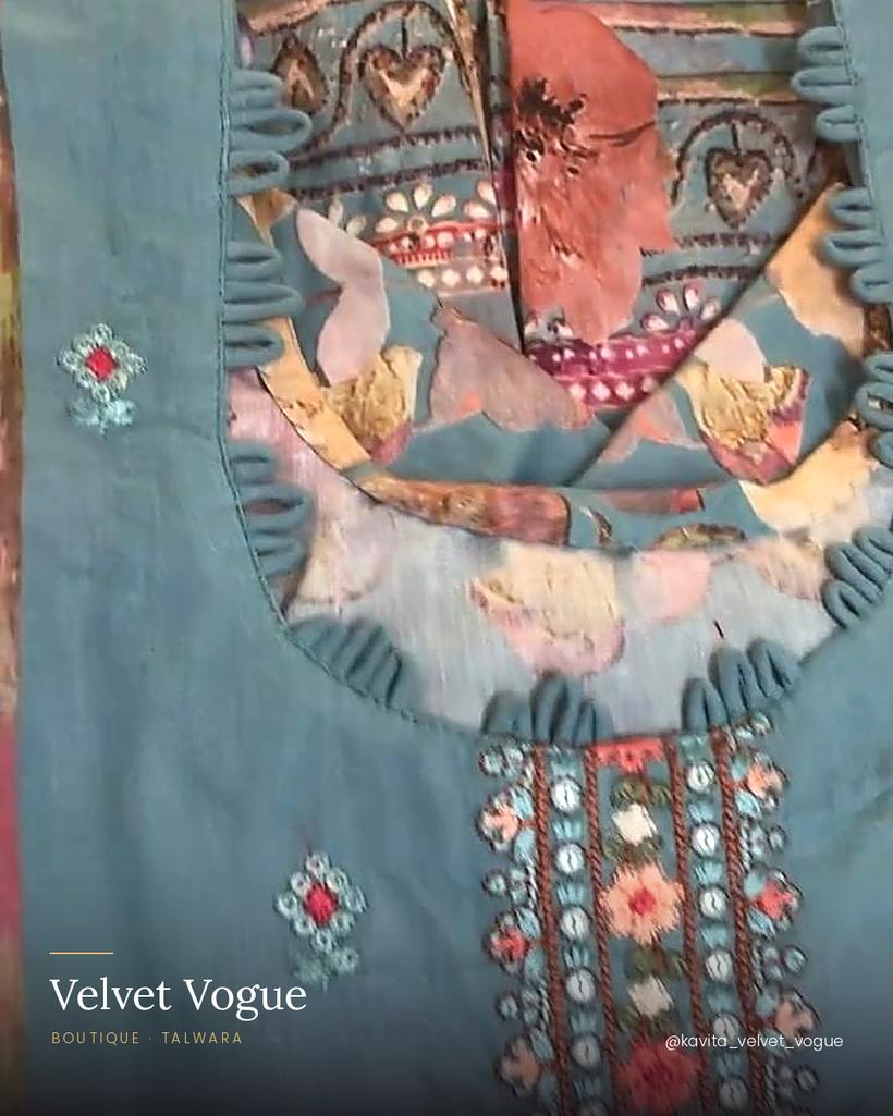 A teal appliqué yoke with an embroidered placket down the front.